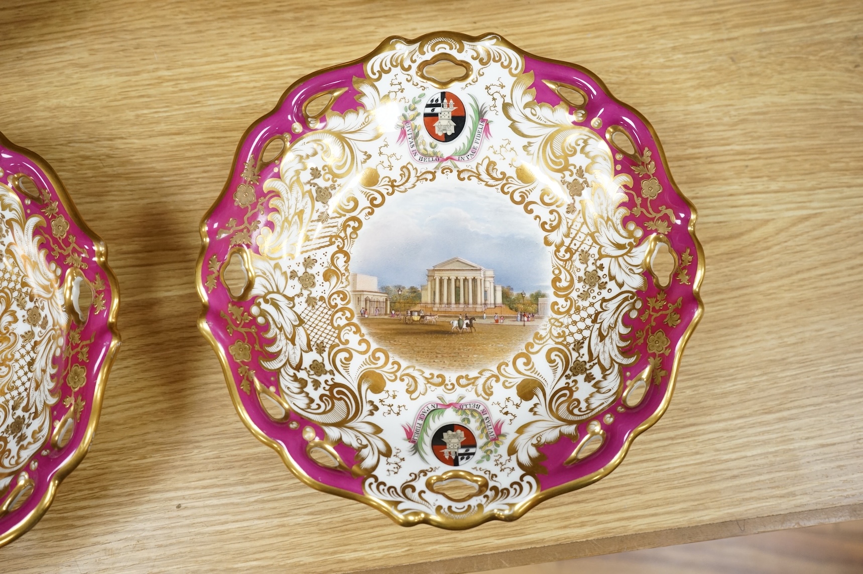 Four G Grainger, Worcester armorial porcelain comports, c.1845, hand painted with named views of Worcester, 24cm in diameter